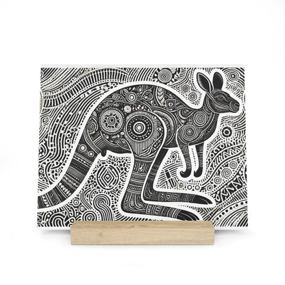 Black and white, highly detailed patterned illustration of a kangaroo on a canvas with a light wooden stand.