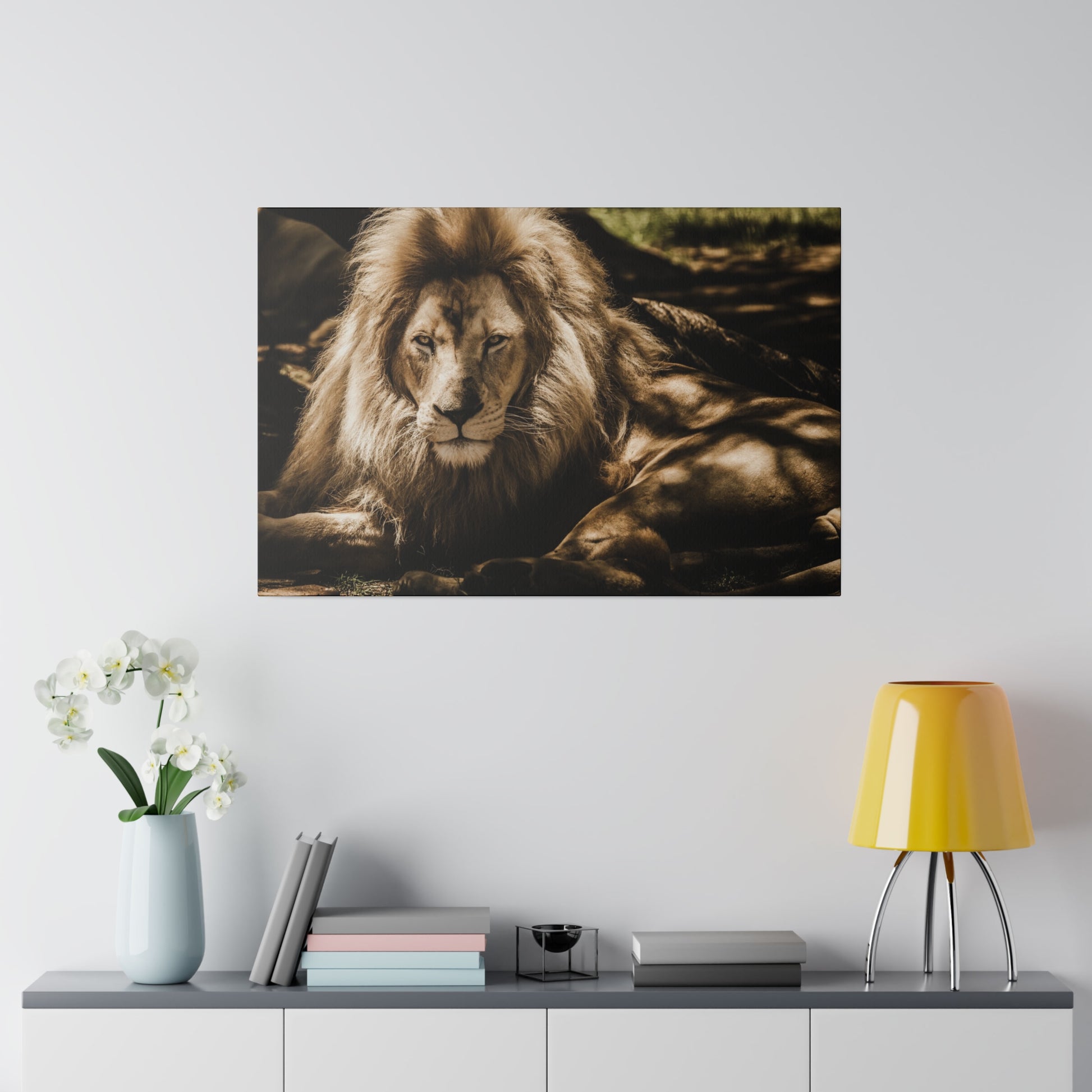 The leader of the pride, a lion resting with an authoritative and calm presence, its mane flowing elegantly.