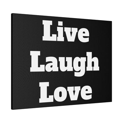 Black canvas wall art with bold white letters displaying the phrase Live Laugh Love.