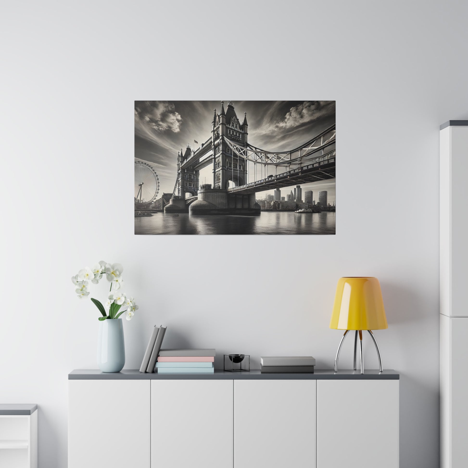 Black-and-white photograph of Tower Bridge over the Thames with the London Eye in the background.