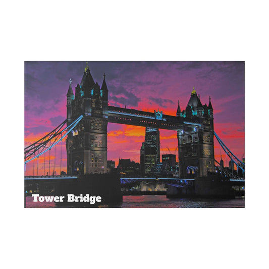 Tower Bridge in London at sunset with orange, pink and purple sky; illuminated towers and blue suspension cables.