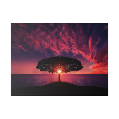 Silhouette of a lone tree atop a grassy hill overlooking the sea at sunset, with the sun behind the trunk and red-purple clouds.