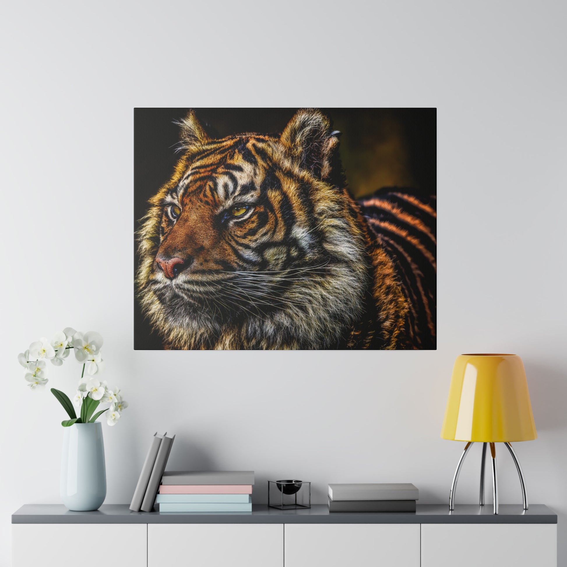 A majestic tiger portrait showcasing the intense gaze of the tiger. The close-up view highlights the intricate patterns and details of its fur and facial features.