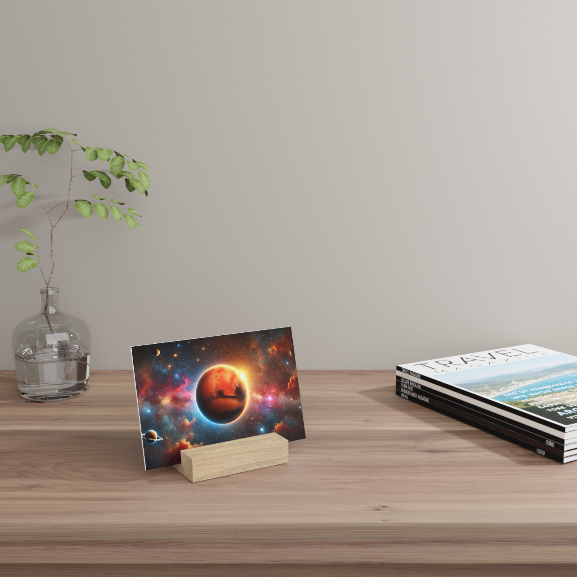 Space-themed postcard showing a red planet on a wooden stand on a light wood desk beside a glass vase with a leafy plant and travel