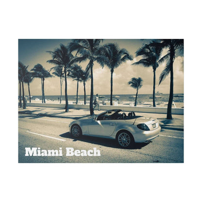Light blue convertible sports car on a road with palm trees and a beach/ocean backdrop.