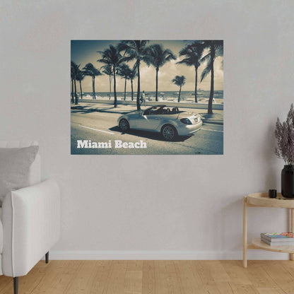 Canvas print of a white convertible on a Miami Beach street with palm trees and the ocean in the background.