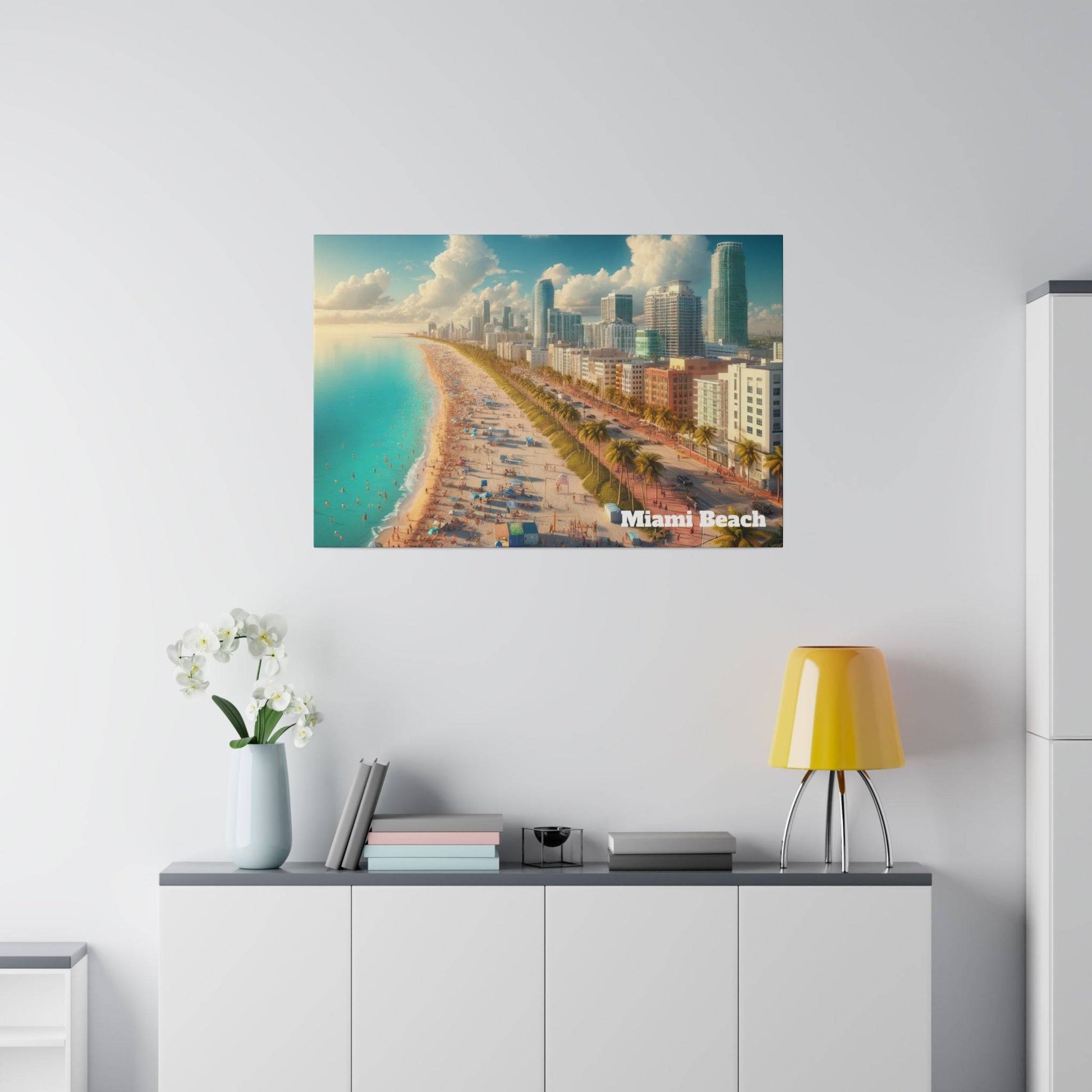 Poster depicting Miami Beach skyline and sandy shoreline along turquoise water, mounted on a white wall above a cabinet.