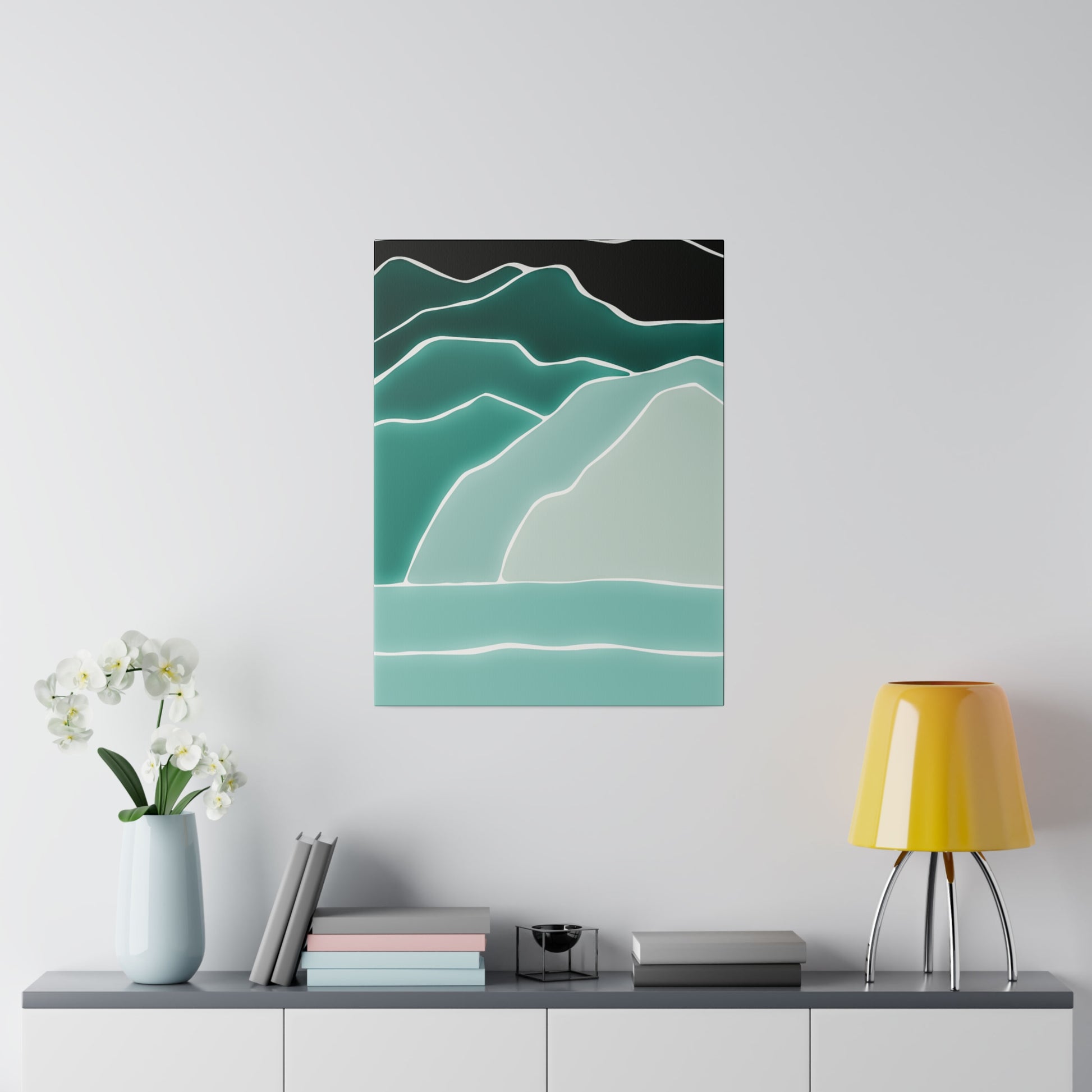 Abstract landscape poster with layered teal, green, and cream mountains and a pale turquoise base, hung above a sideboard.