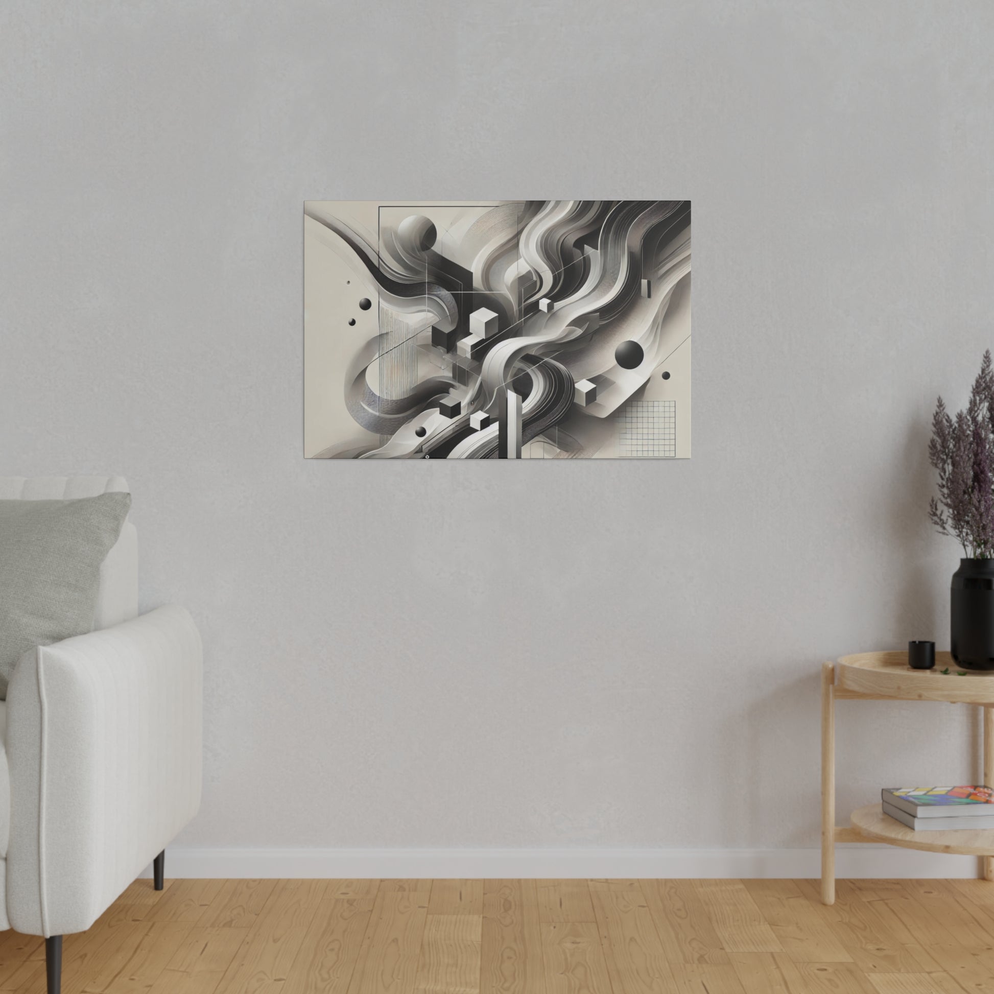 Abstract black-and-white geometric artwork mounted on a light beige wall above a sofa.