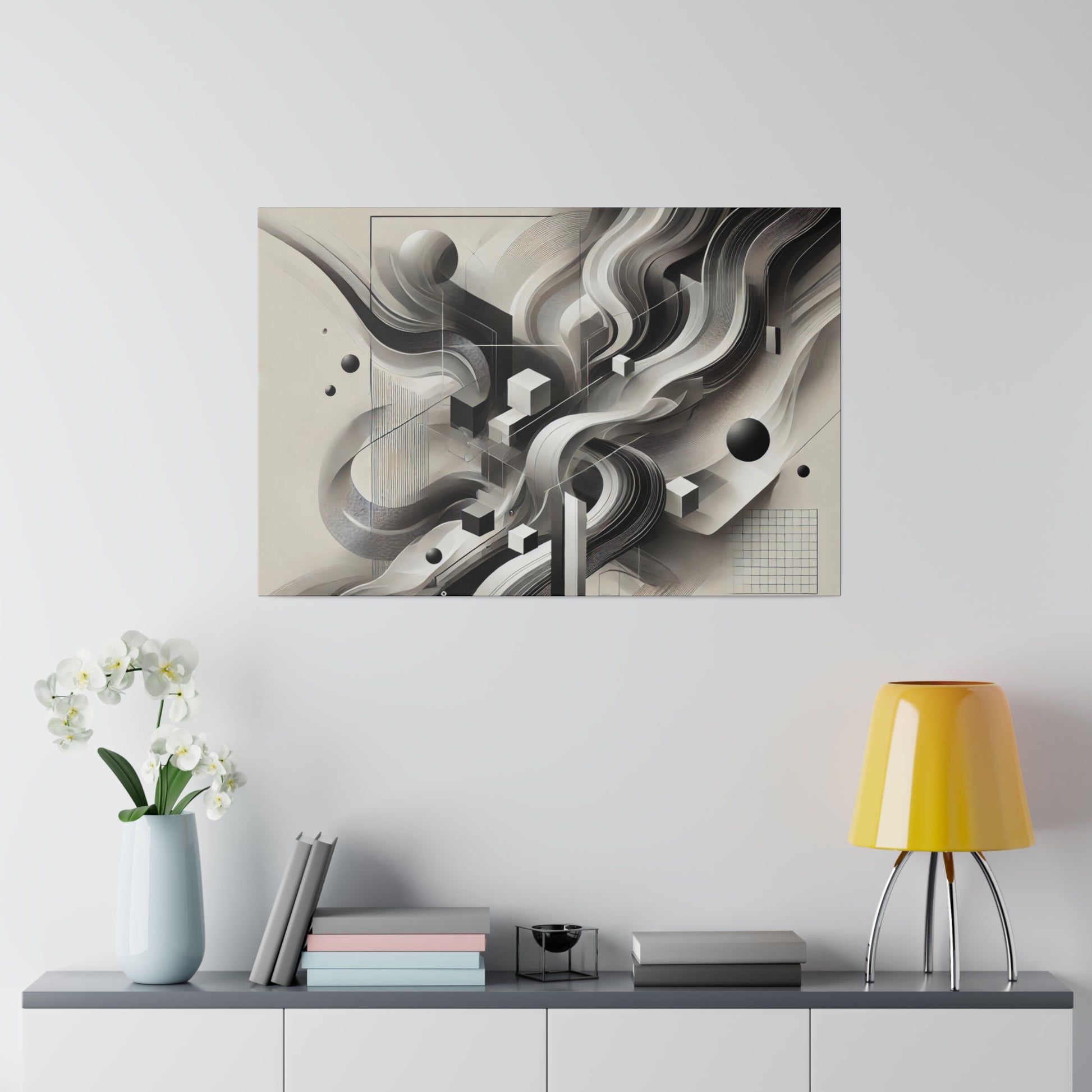 Abstract black-and-white geometric artwork on a light gray wall above a gray console, with a pale blue vase of white flowers and a yellow