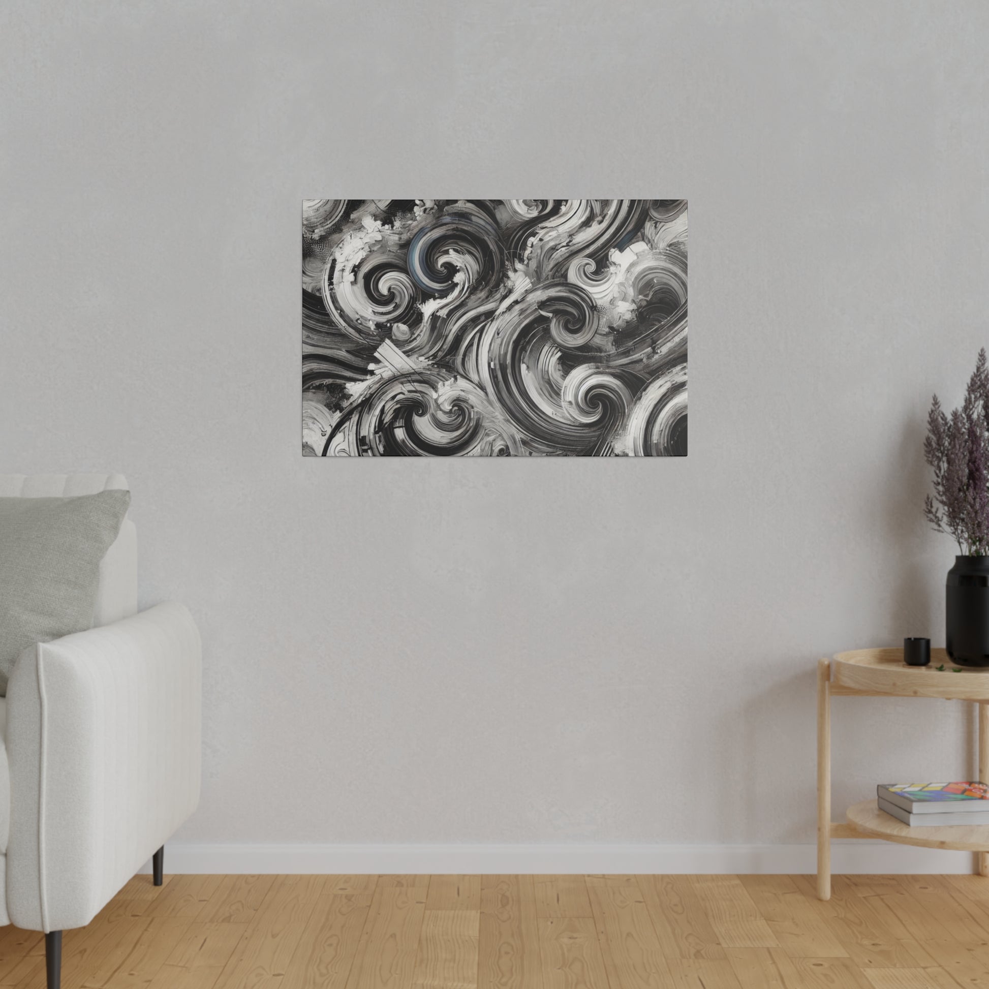 Rectangular black-and-white abstract swirling painting hung on a light gray wall in a minimalist living room.
