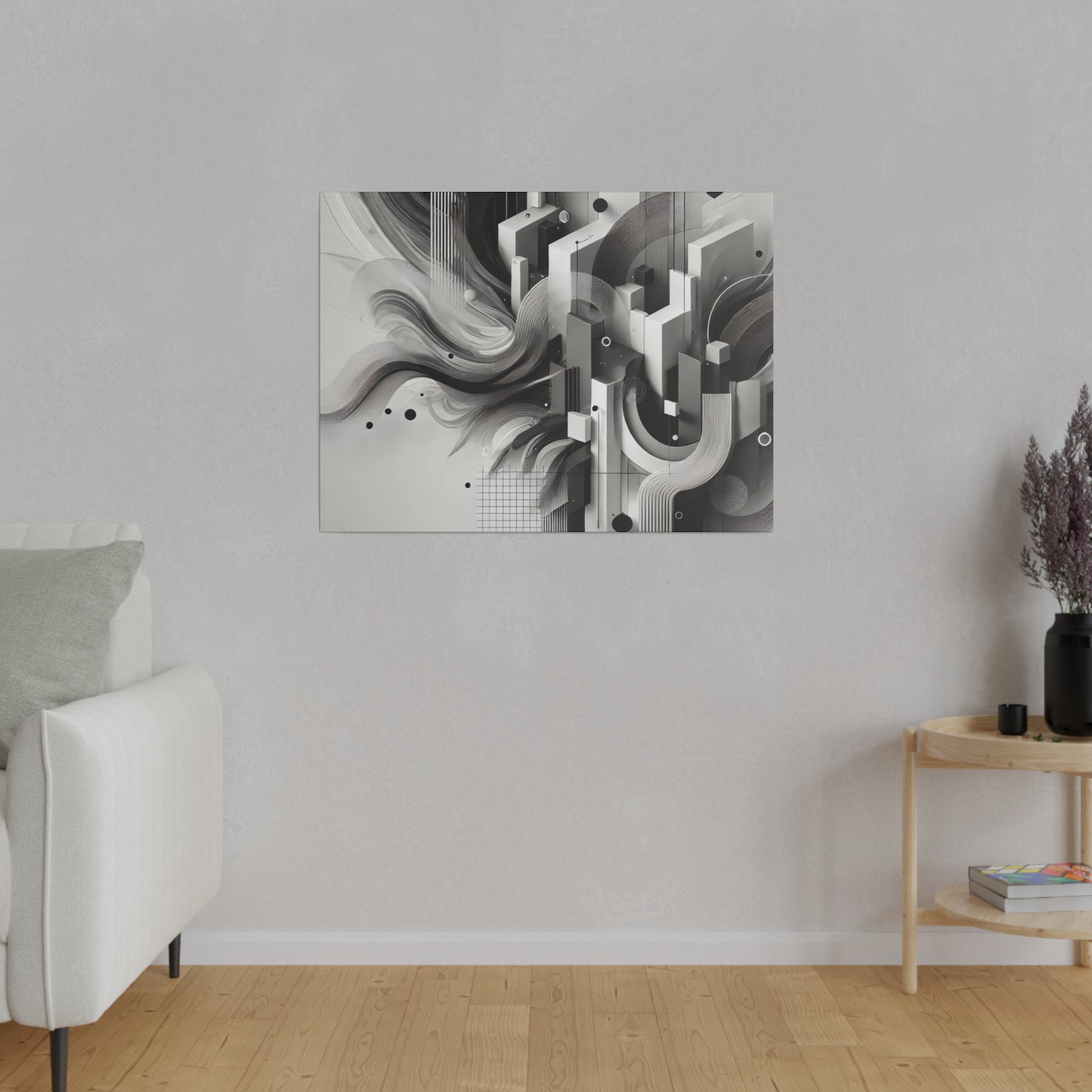 Black and white abstract geometric artwork mounted on a light gray living room wall.