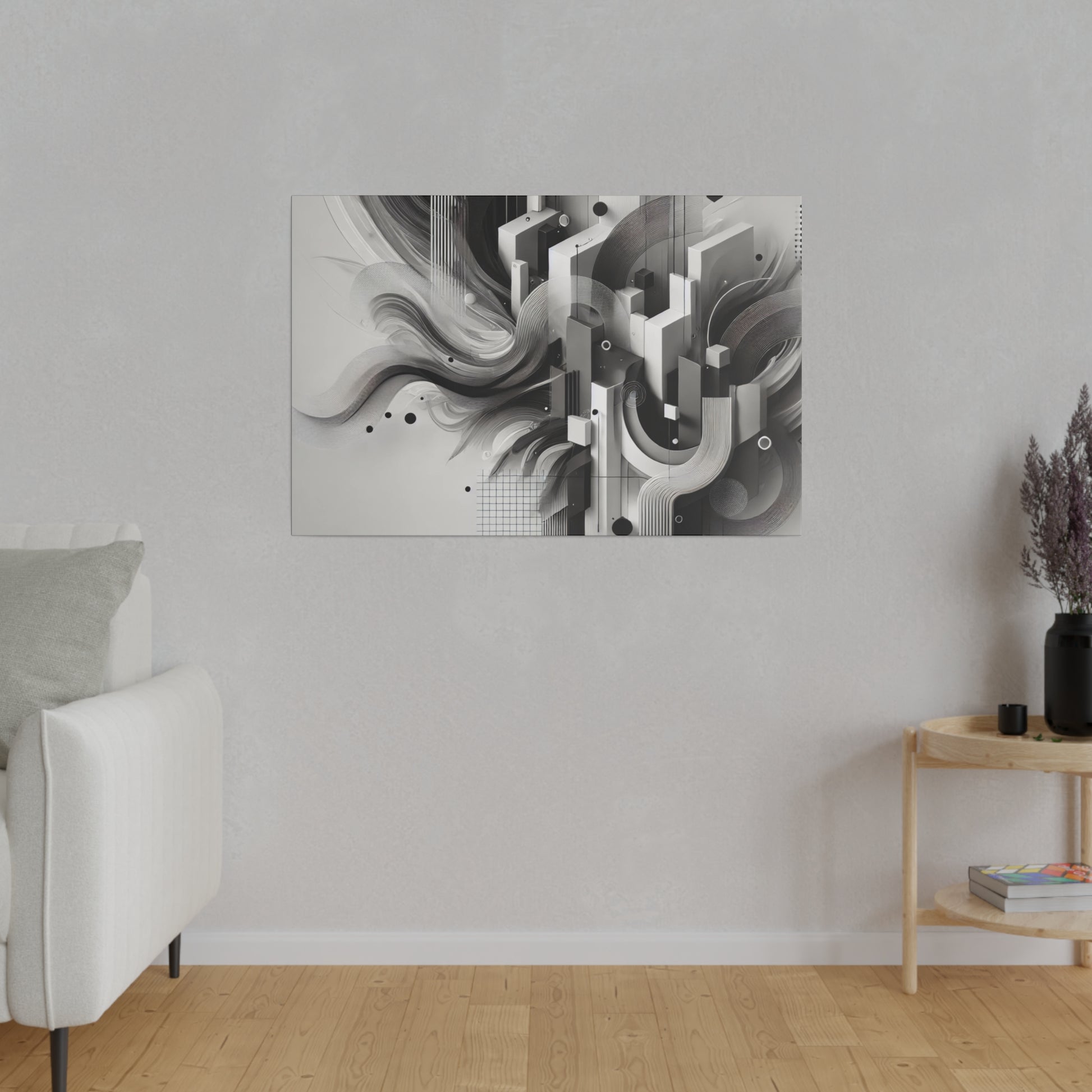 Gray abstract geometric wall art with black and white shapes mounted on a light gray living room wall.