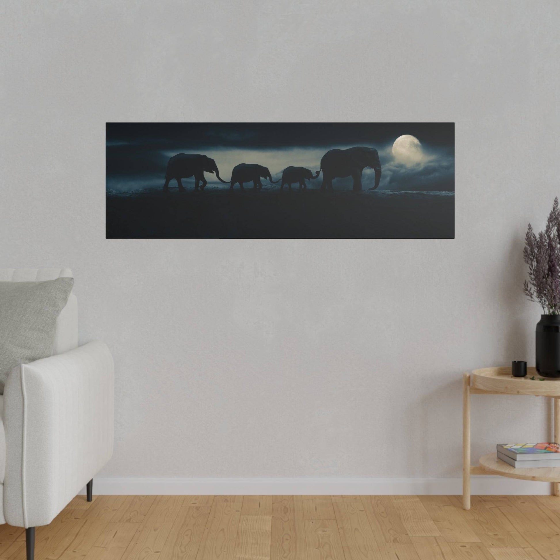 Rectangular wall art depicting silhouetted elephants walking in a moonlit night against a dark blue sky.