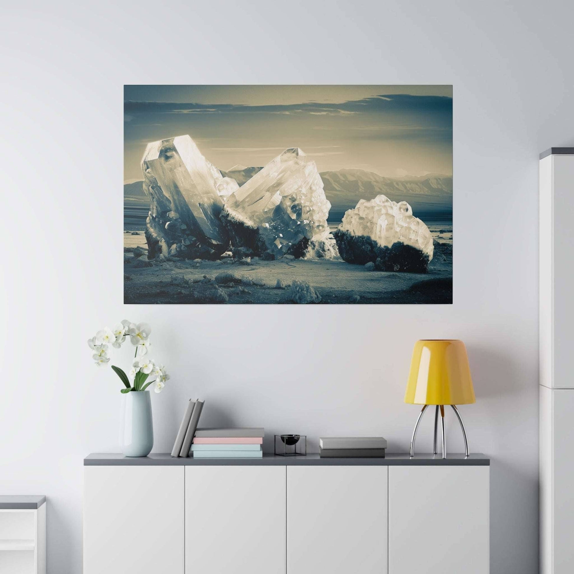 Canvas art print of pale blue ice crystals on a sandy shore with distant mountains in the background.