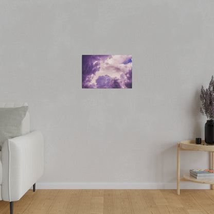 Small rectangular wall art showing a purple cloudy sky, mounted on a light gray living room wall.