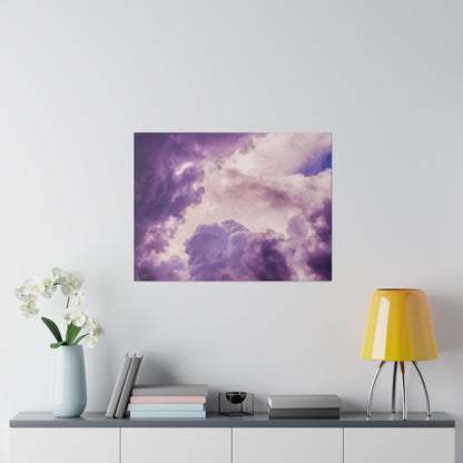 Square wall art print depicting a purple and lavender cloudy sky above a console with a light blue vase of white orchids, books, and a