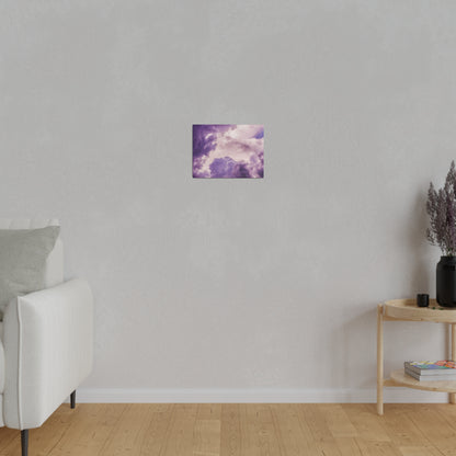 Small square wall art featuring purple clouds against a gray wall.