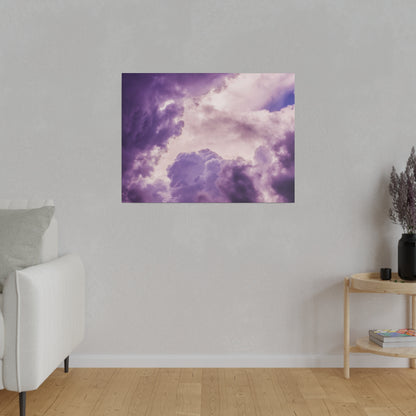 Purple cloud artwork mounted on a light gray wall above a wooden floor in a modern living room.