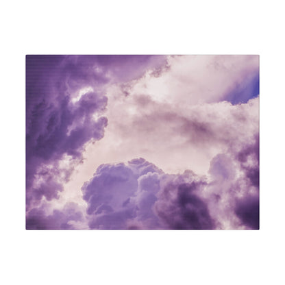 Cloud-filled sky with varying purple and lavender hues, featuring fluffy, billowing clouds.