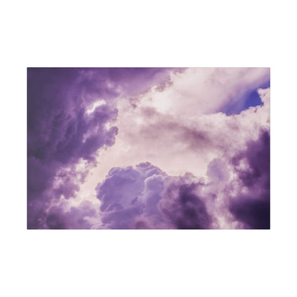 Purple and lavender storm clouds fill the sky with dramatic, billowy formations.