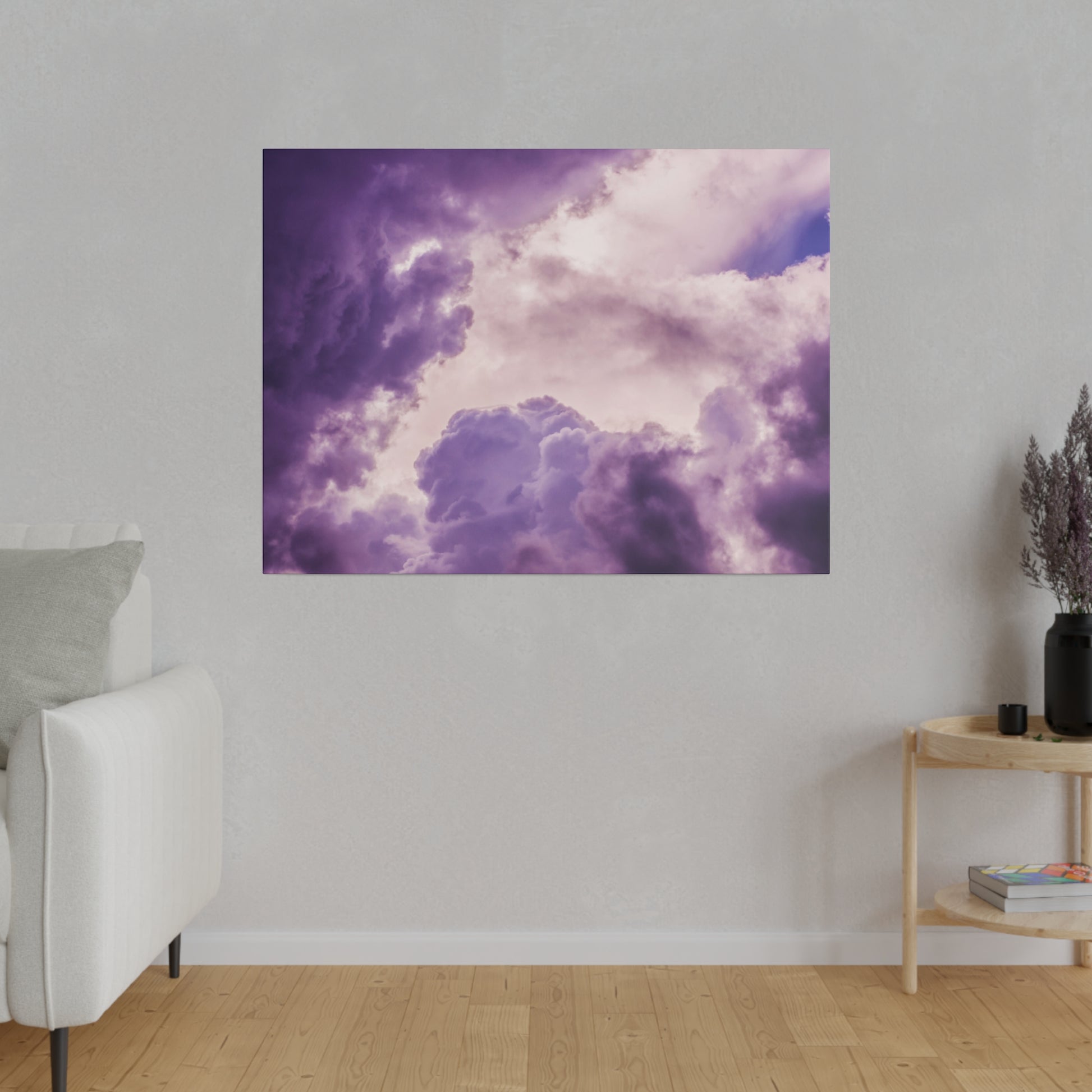Canvas print of purple, lavender storm clouds hanging on a light gray wall.