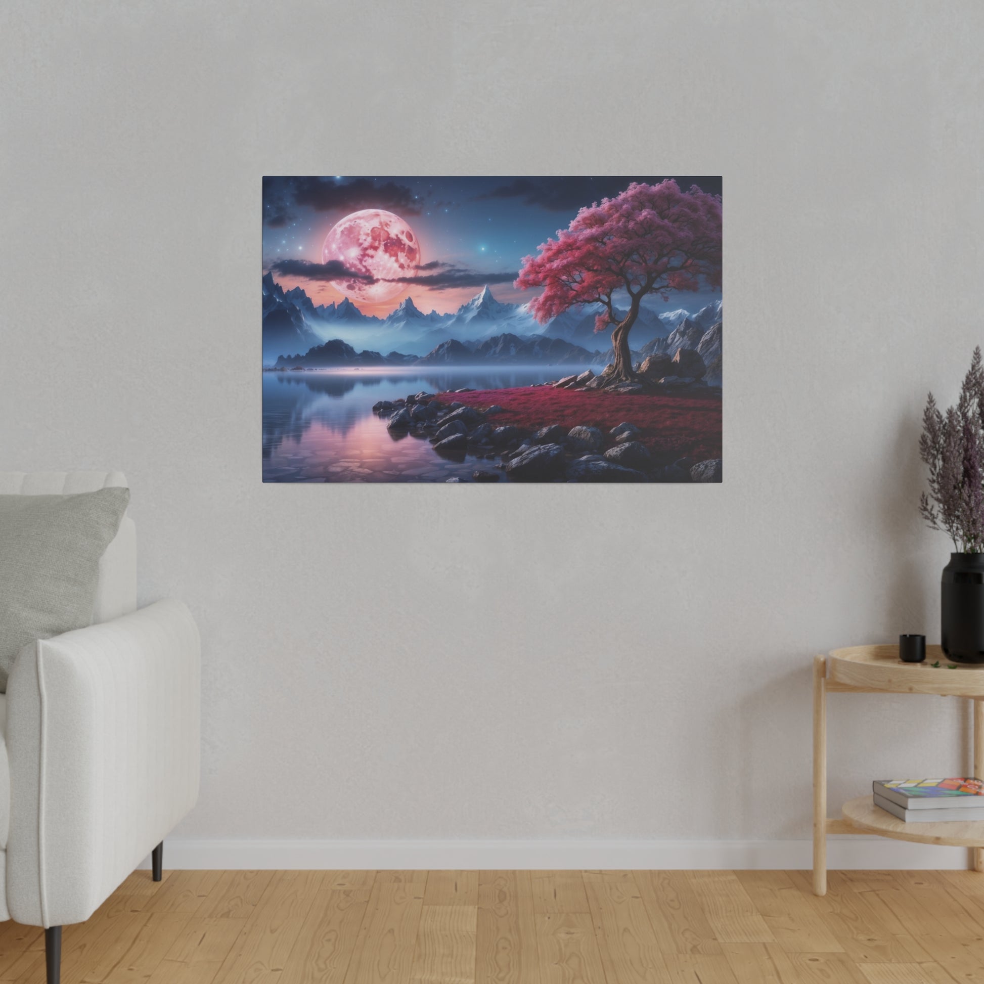 Framed fantasy landscape wall art showing a pink full moon over blue mountains, a reflective lake, and a pink-leaved tree on a rocky shore.
