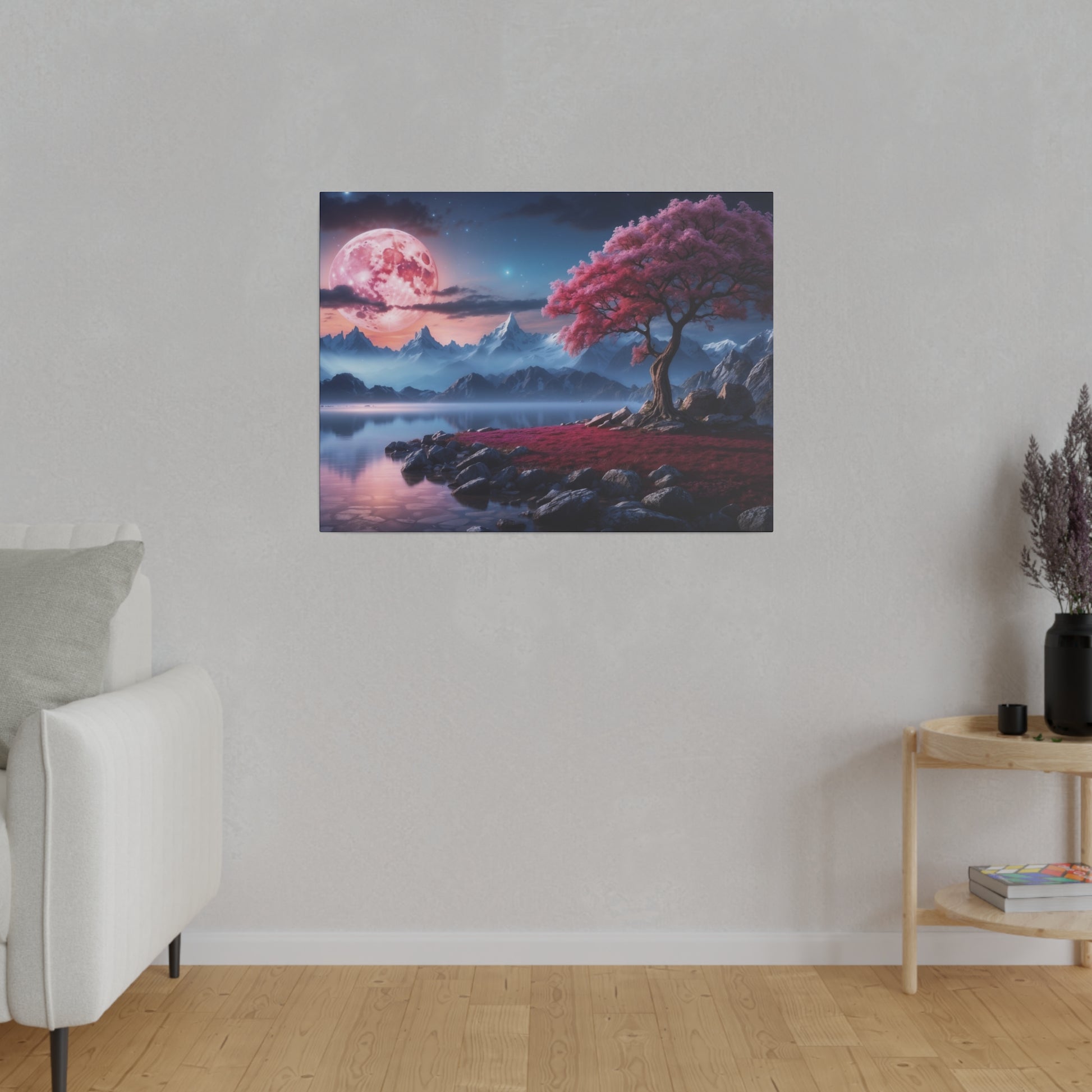 Canvas wall art showing a pink moon over blue mountains, a pink-leaved tree by a lake with rocky shoreline.