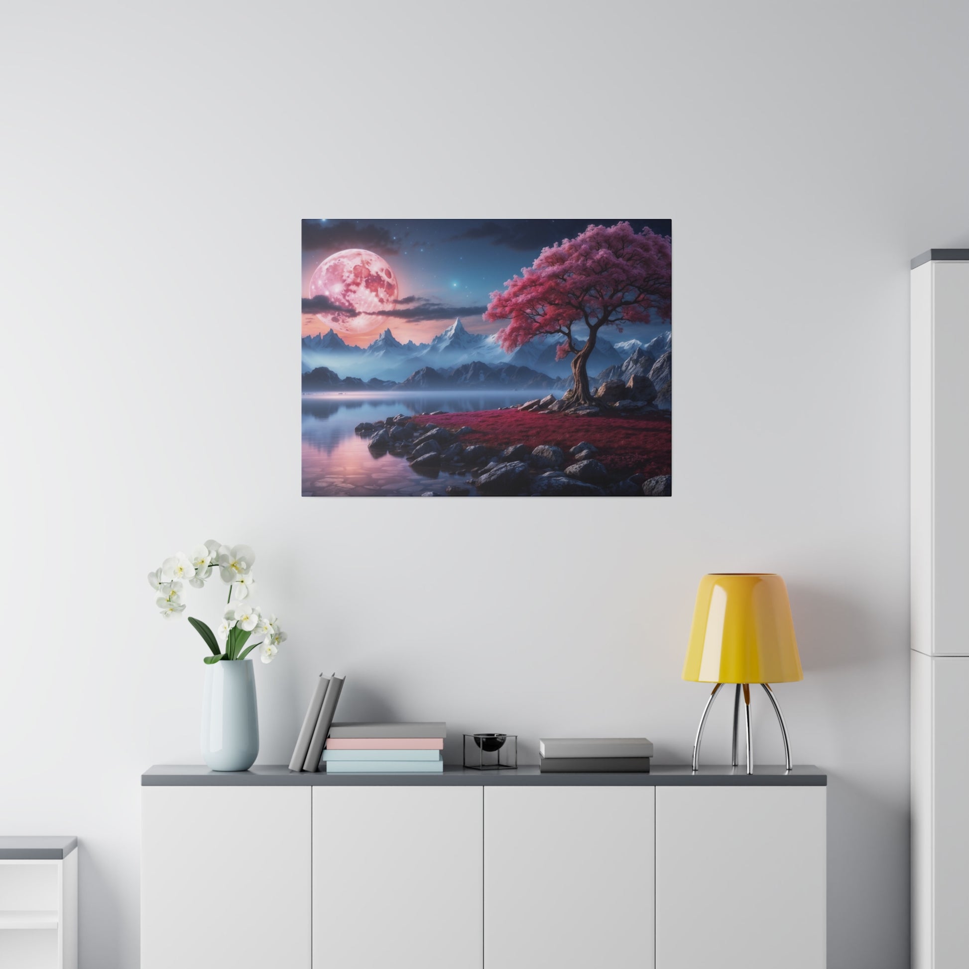 Square landscape print of a pink tree beside a rocky lake with mountains and a pink moon in the sky.