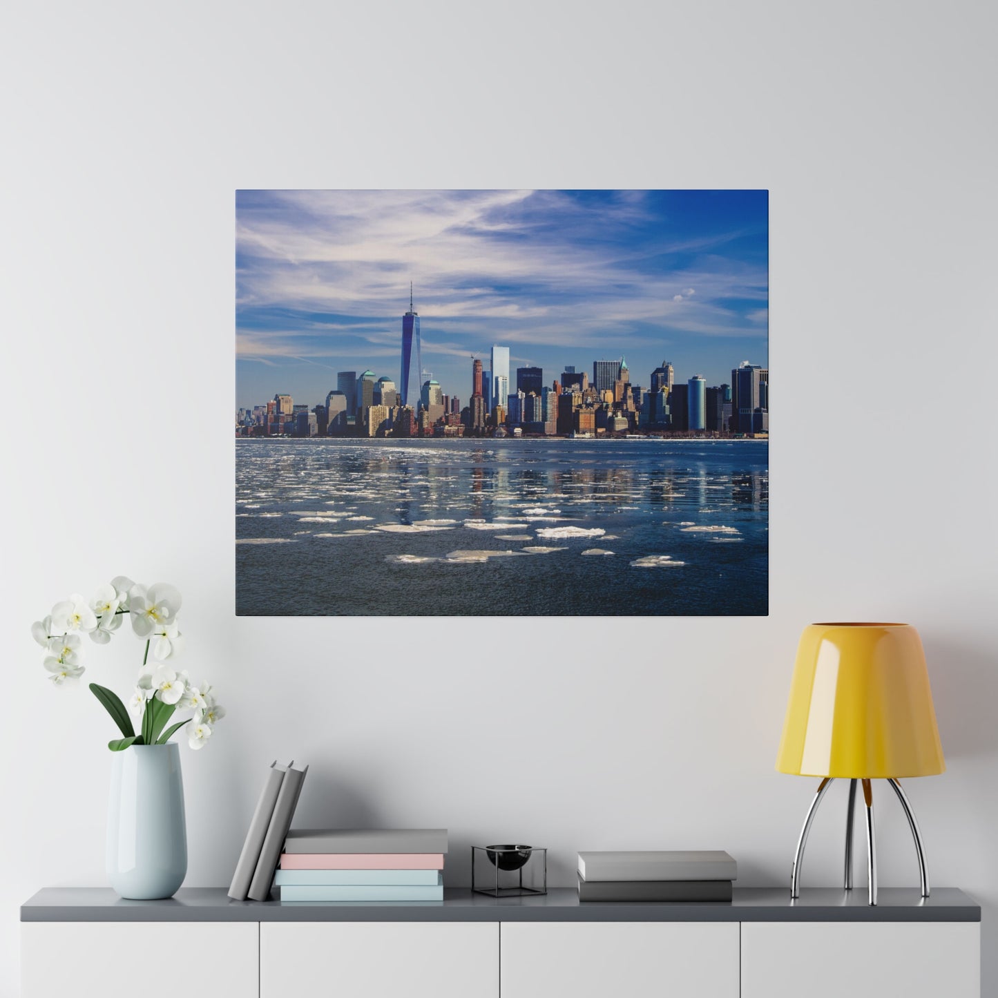 A stunning view of the New York City skyline during the daytime, showcasing the iconic skyscrapers reflecting on the water.