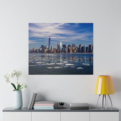 Square wall art print of a city skyline across icy water with blue sky and clouds.