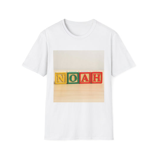 White T-shirt featuring a printed photo of four colorful wooden blocks spelling NOAH on a light wooden surface.