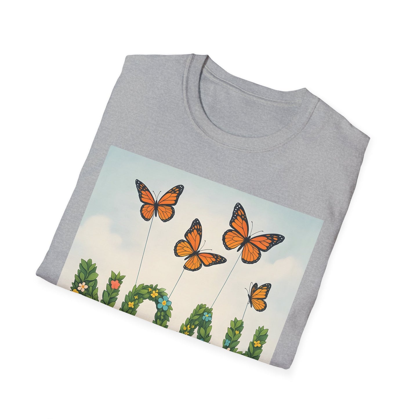 Light gray crewneck T-shirt folded, with a printed rectangular scene of orange monarch butterflies and green plants against a pale sky.