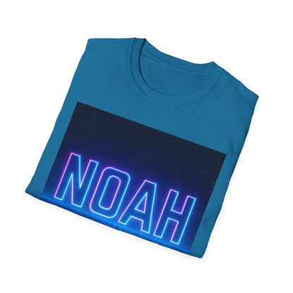 Blue T-shirt folded with a large rectangular graphic featuring neon-blue "NOAH" lettering across a dark gradient background.