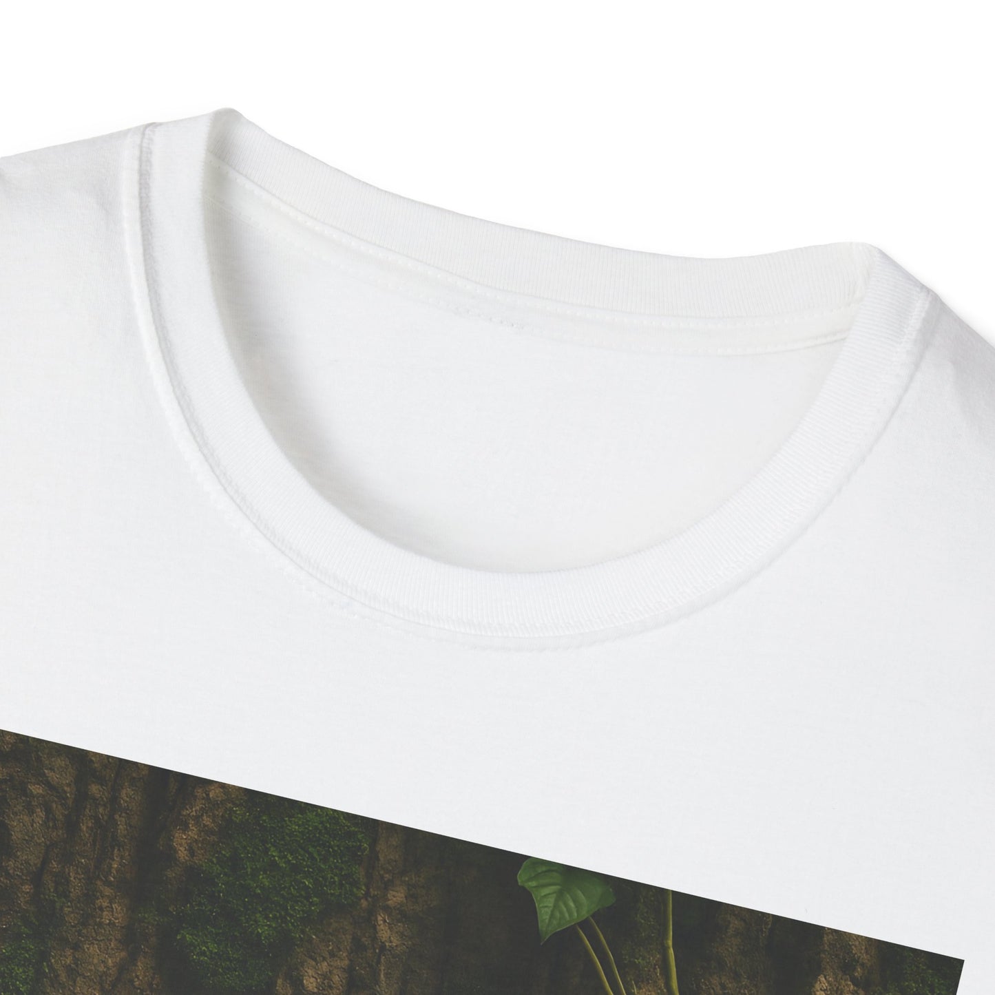Close-up of a white crew-neck T-shirt with a diagonal forest graphic showing tree bark and green leaves.