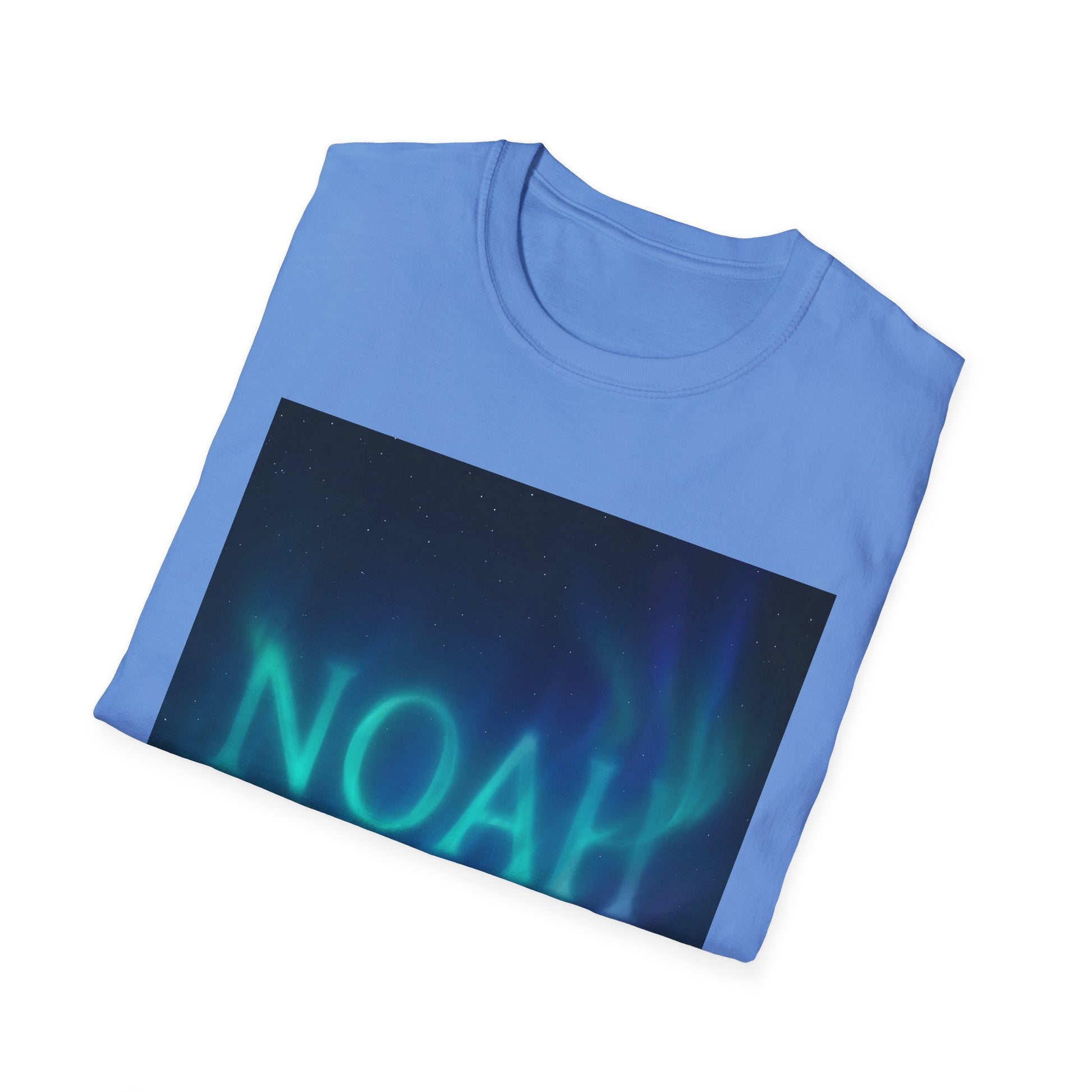 Light blue folded t-shirt with a rectangular graphic depicting a night sky and green aurora borealis.