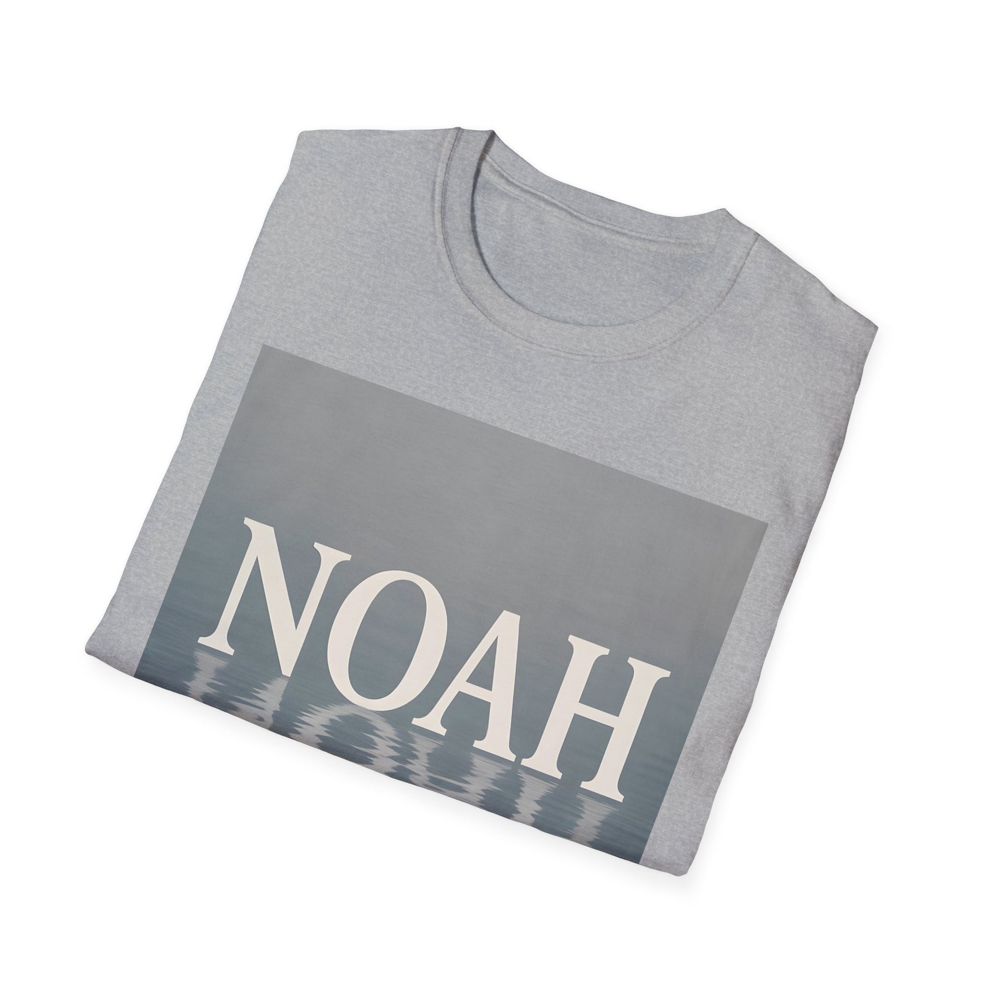 Light gray folded T-shirt with a blue-gray rectangle graphic showing the word NOAH and a water-reflection pattern.