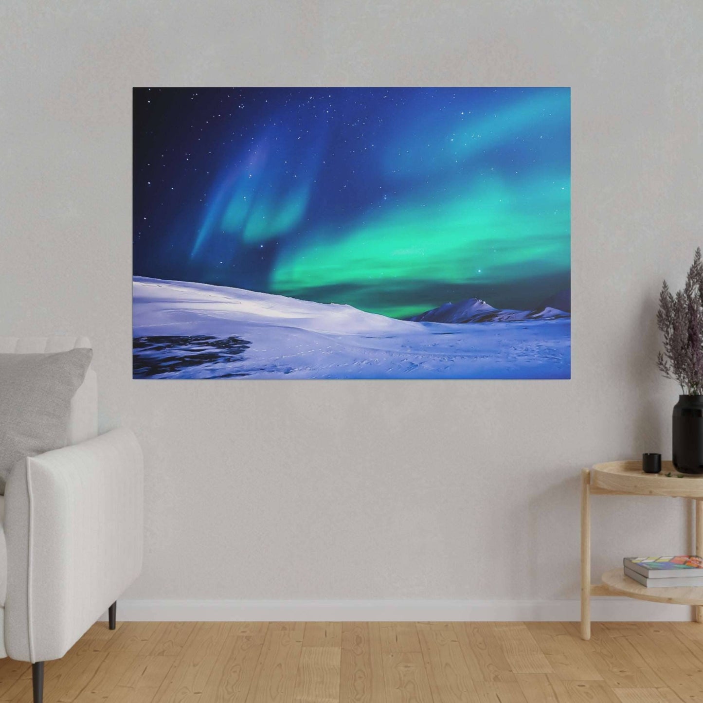 Canvas art print depicting the Northern Lights in green and blue hues over a snow-covered landscape.