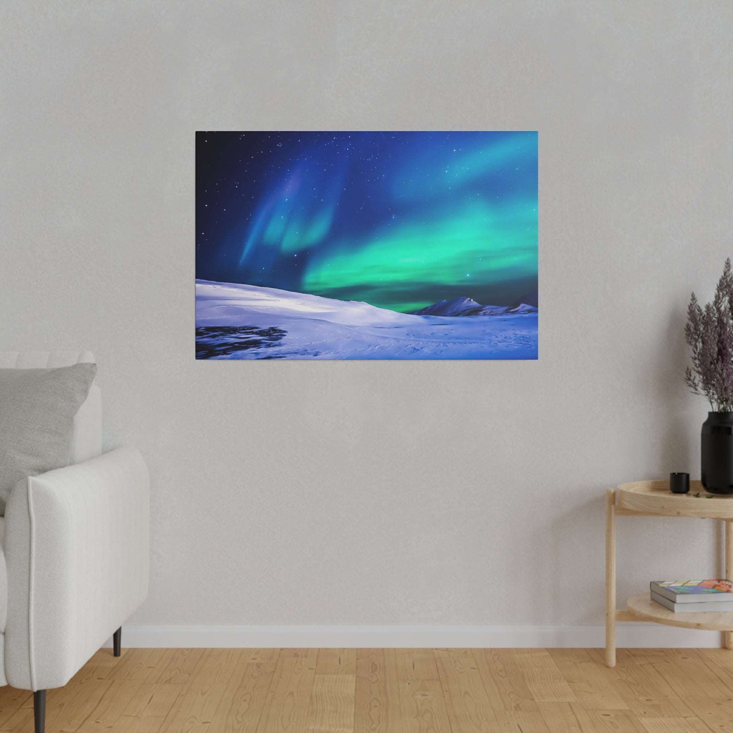 Canvas art print of the Northern Lights (green and blue) over a snow-covered landscape with a starry night sky.