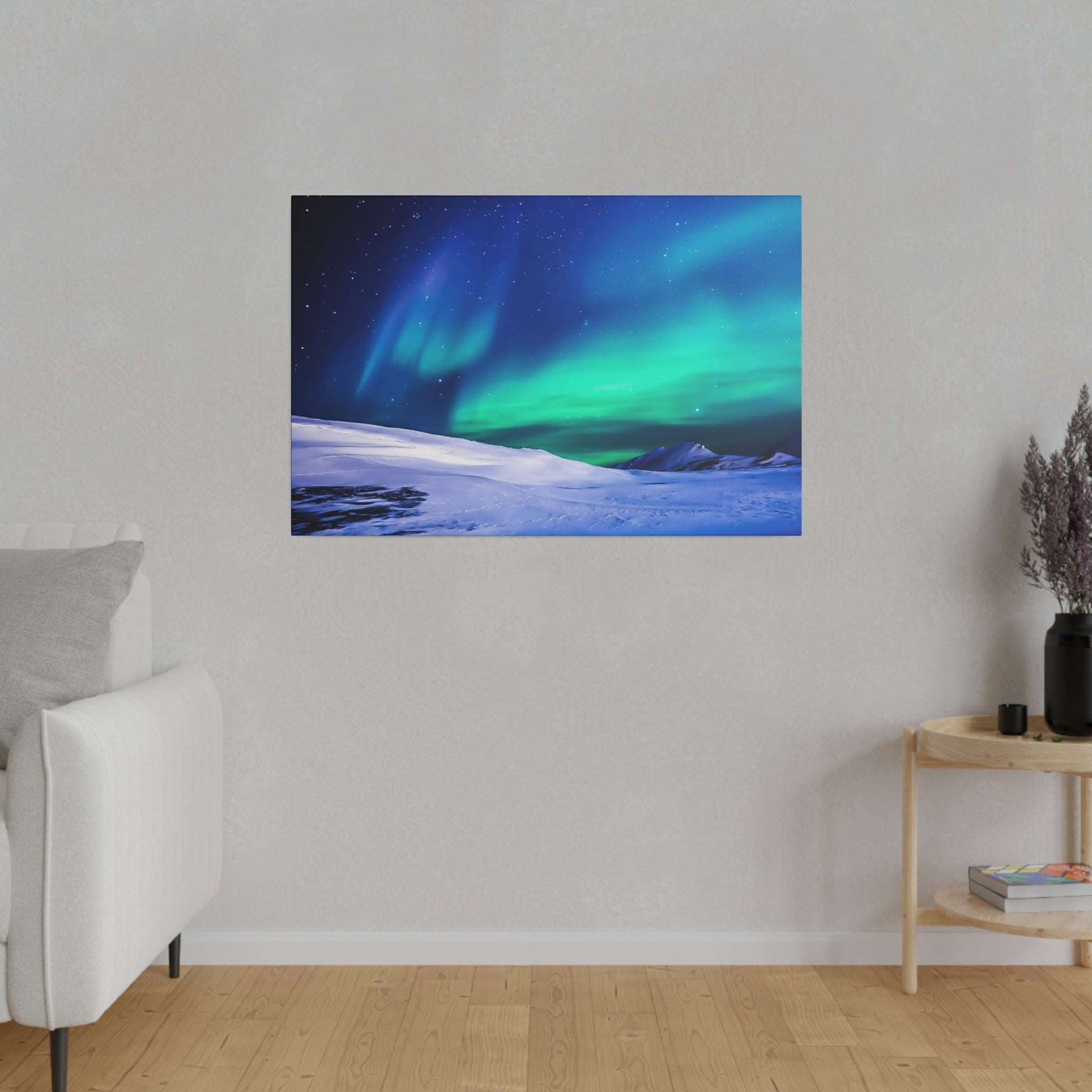 Canvas art print of the Northern Lights (green and blue) over a snow-covered landscape with a starry night sky.