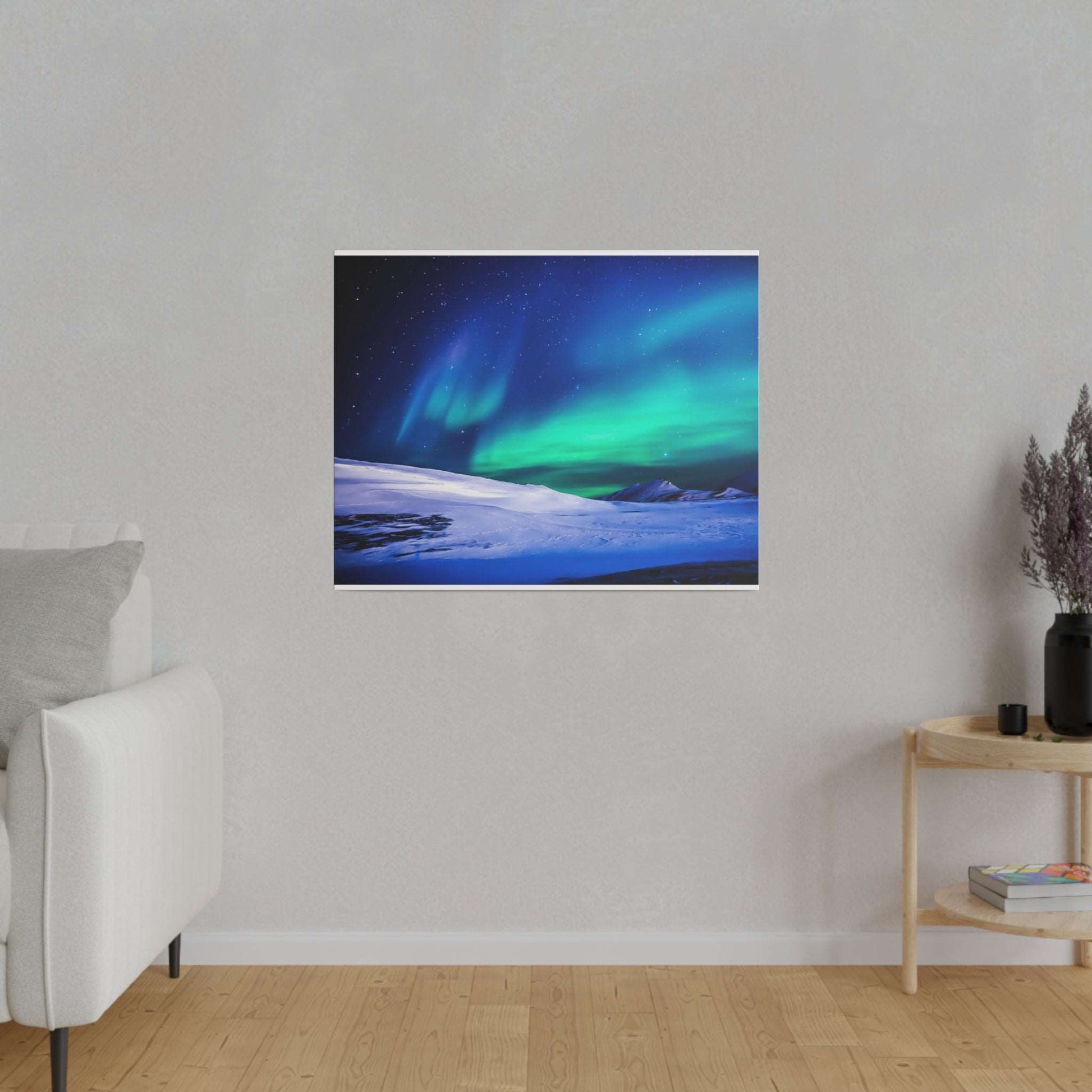 Square-framed canvas print of a green and blue aurora borealis over a snow-covered landscape.