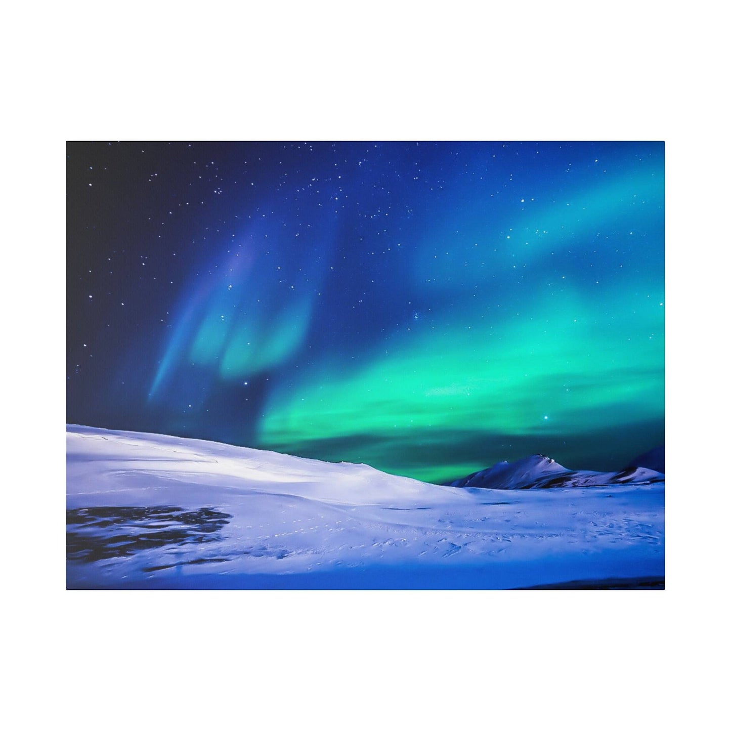 Nighttime landscape with snow-covered hills under a colorful aurora borealis in green and blue across a starry sky.