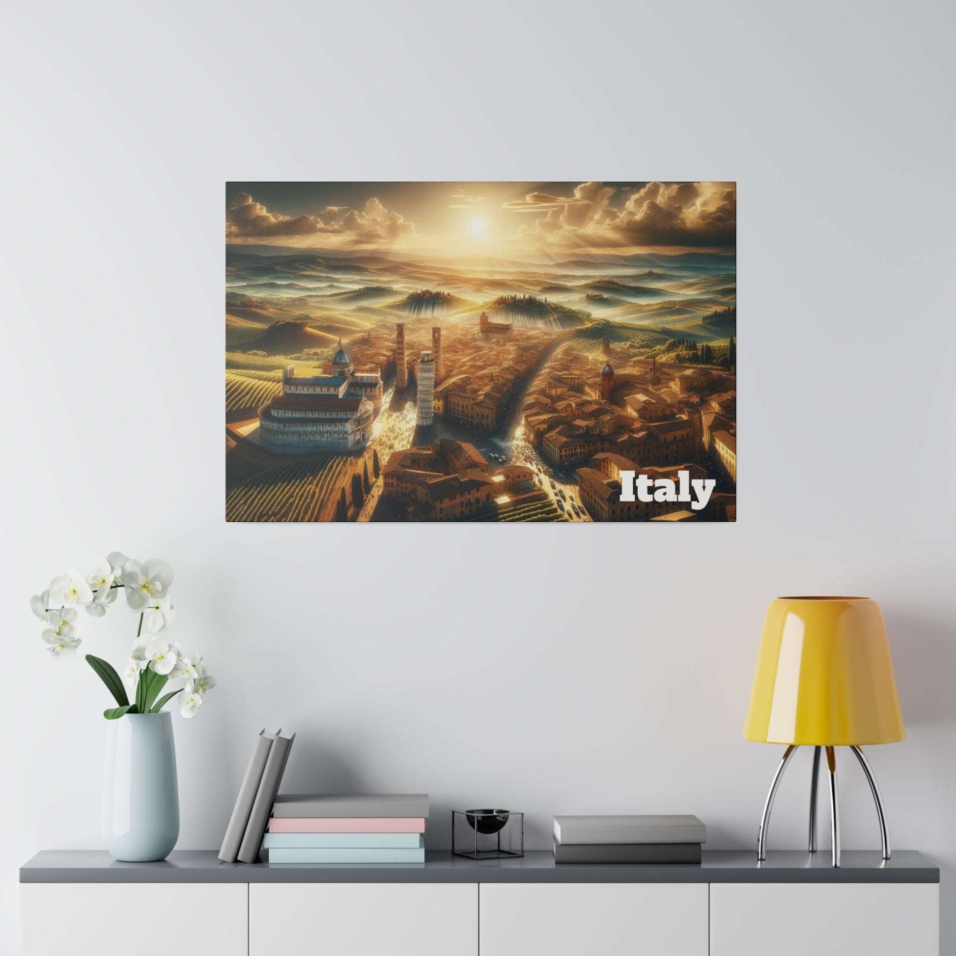 Canvas poster showing a sunlit Tuscan hill town with terracotta buildings, vineyards, and "Italy" in white.