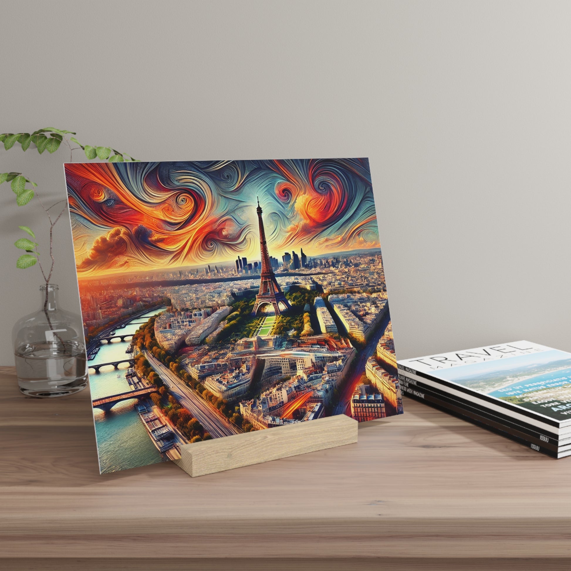 Colorful canvas print of Paris with the Eiffel Tower and swirled red, orange, blue sky, propped on a wooden display stand on a table.