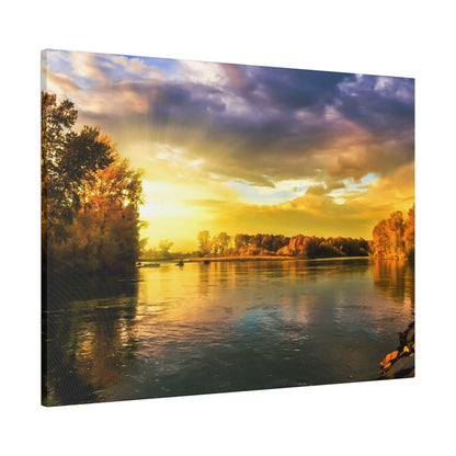 Sunset over a calm river with golden light reflecting on the water; trees line both riverbanks.