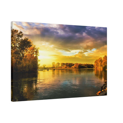 Canvas print showing a wide river at sunset, with golden-orange sky reflecting on the calm water and tree-lined banks.