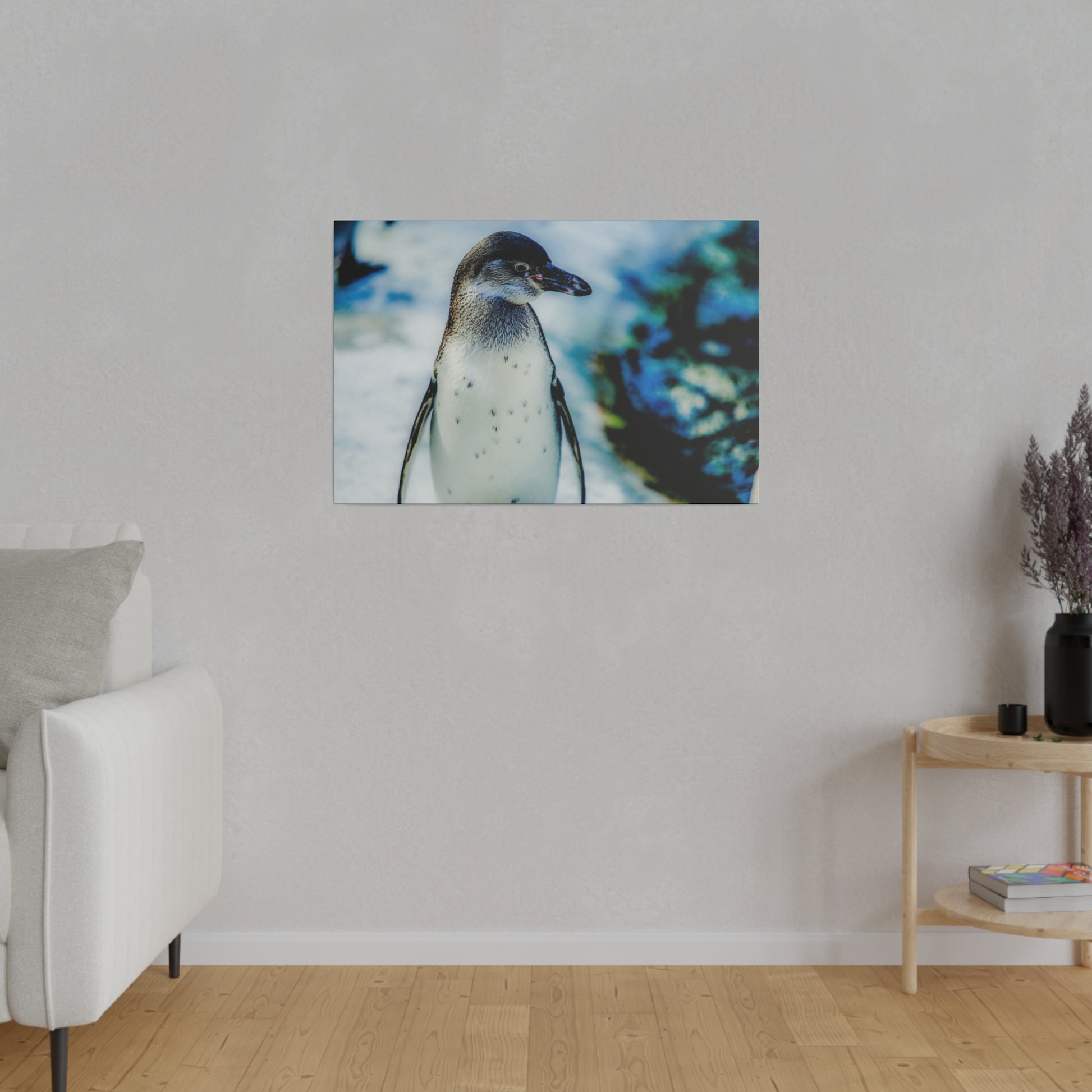 A penguin against a chilly background, standing in the snow. The image captures the penguin in its natural habitat, surrounded by ice and snow.