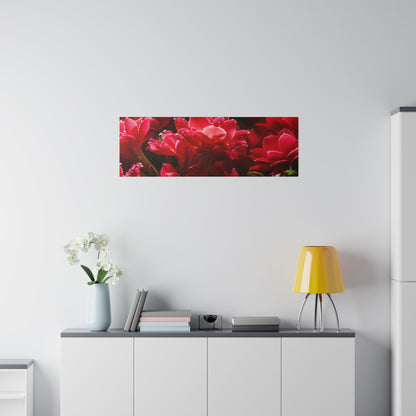 Living room with a white sideboard, yellow lamp, blue vase with white orchids, and a red floral wall panel.