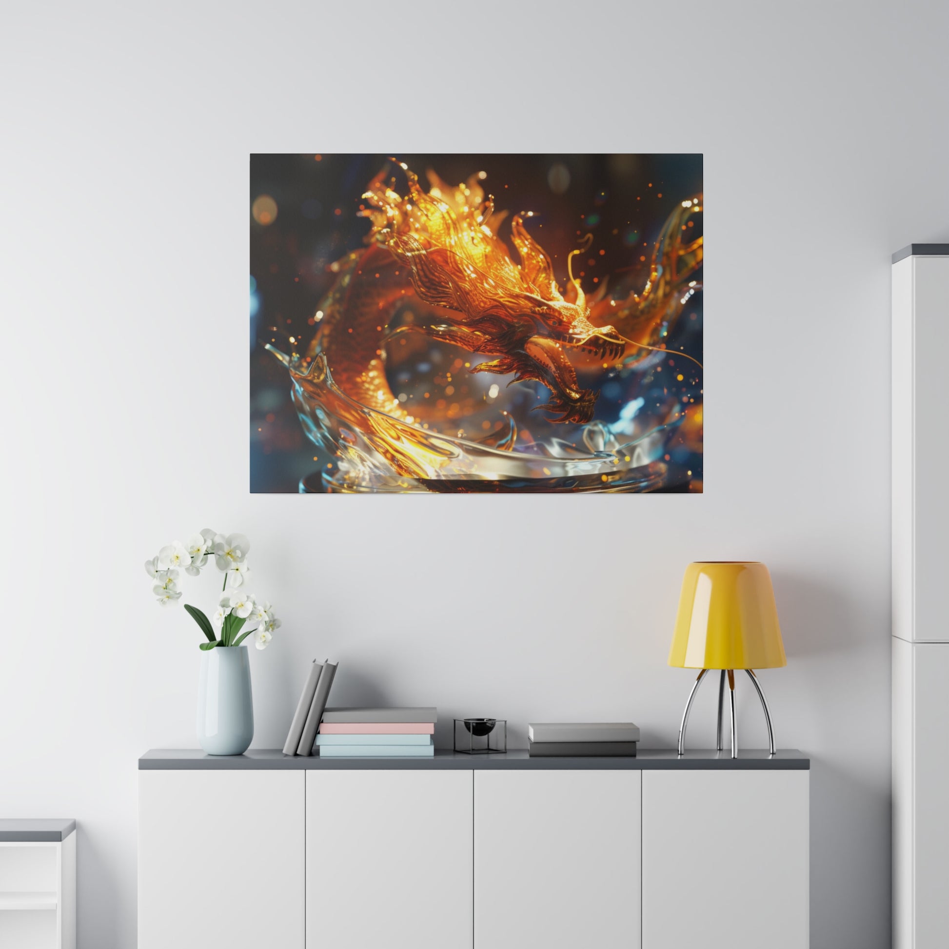 Framed print of a fiery orange dragon in flight above a white cabinet with a vase, books, and a yellow table lamp.