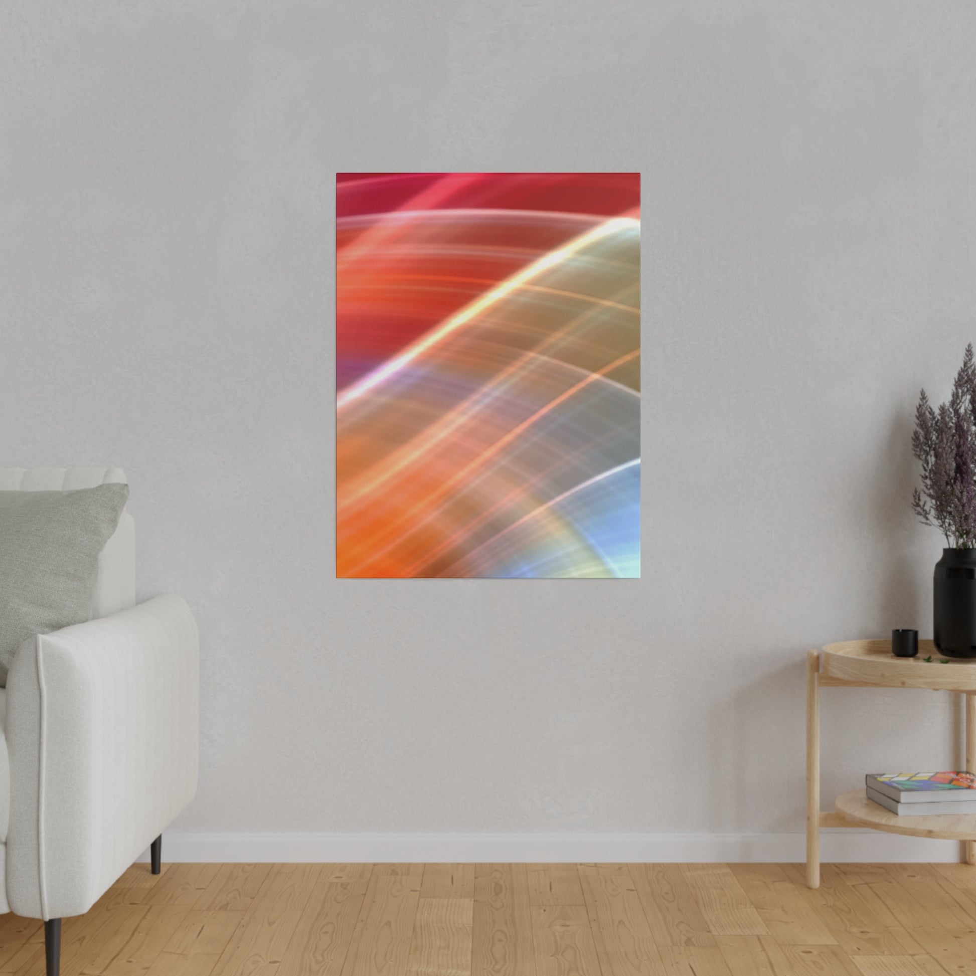 Vertical abstract poster with diagonal multicolored light streaks (orange, red, blue) on a gray wall.